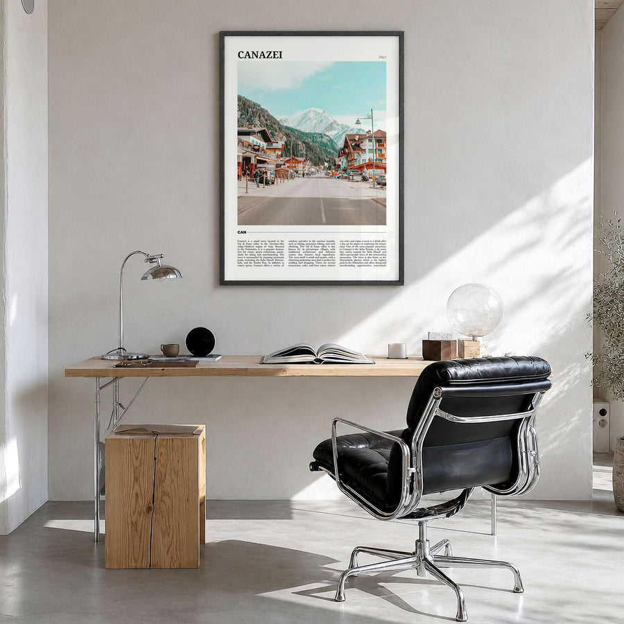 Canazei Travel Poster in a black wood frame, hanging in a bright home office
