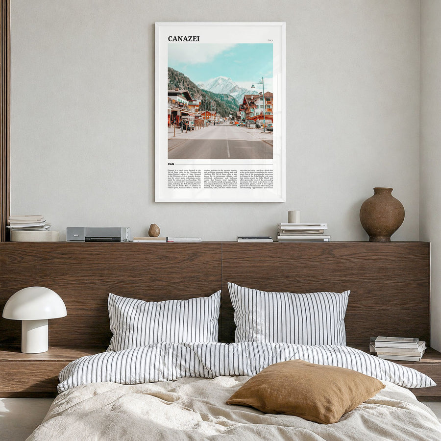 Canazei Travel Poster in a white wood frame, hanging in a bedroom