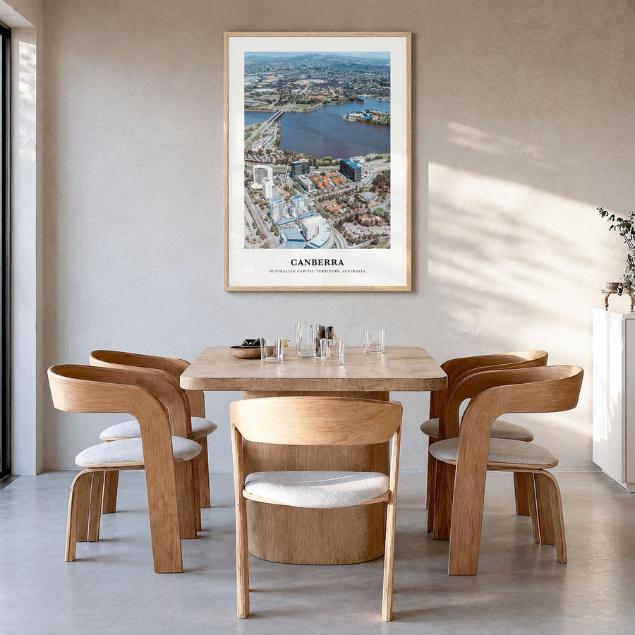 Canberra Classic Poster in a natural wood frame, hanging in a dining room