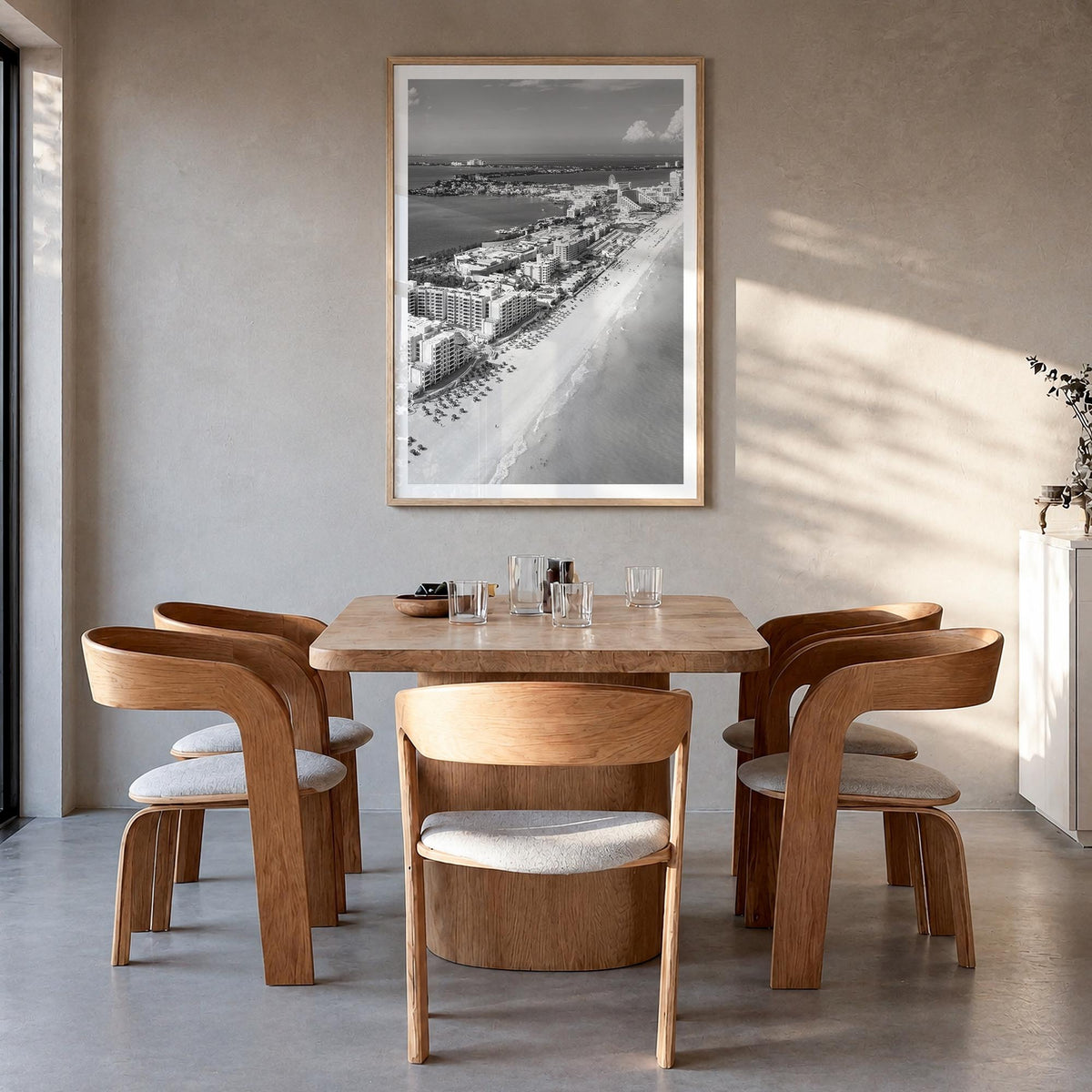 Cancún black & white photo poster of Mexico – vertical wall art in natural wood frame with white border, hanging on wall