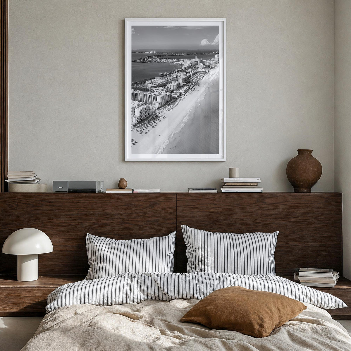 Cancún black & white photo poster of Mexico – vertical wall art in white wood frame with white border, hanging on wall