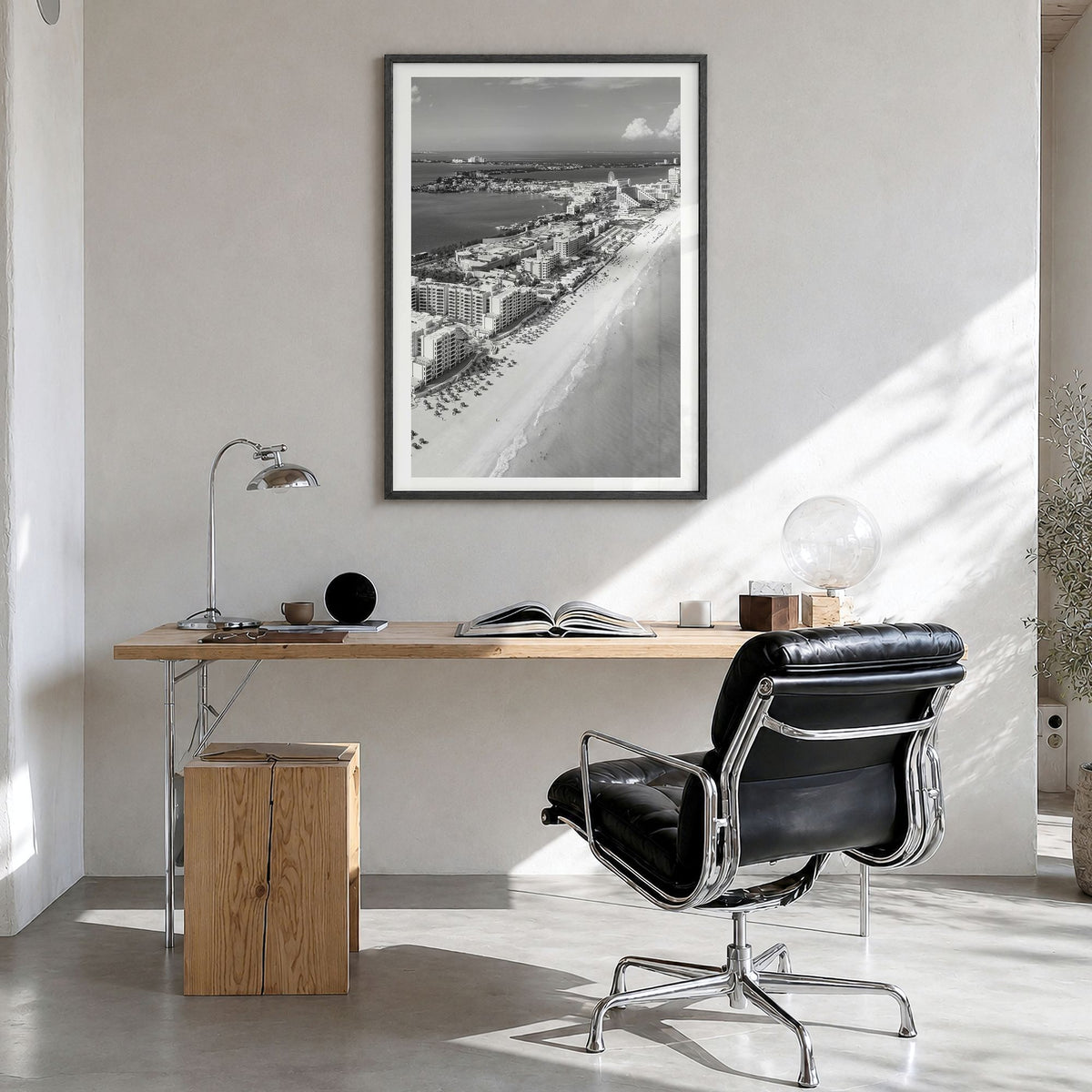 Cancún Photo Poster in a black wood frame, hanging in a bright home office, white border