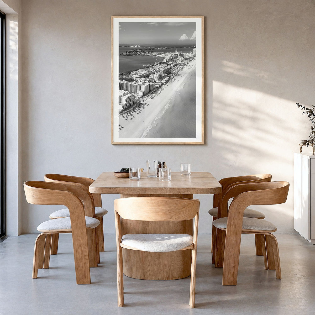 Cancún Photo Poster in a natural wood frame, hanging in a dining room, white border