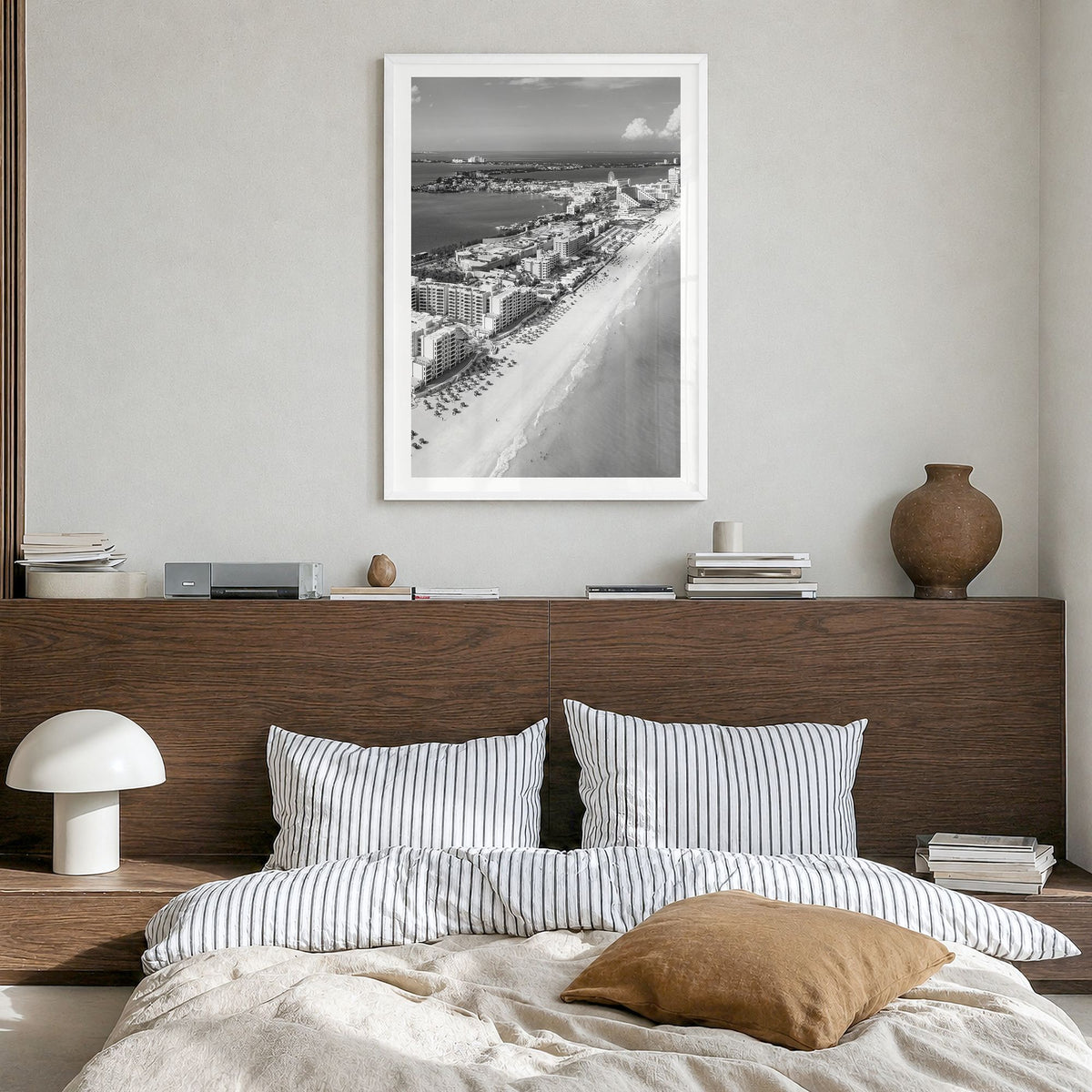 Cancún Photo Poster in a white wood frame, hanging in a bedroom, white border