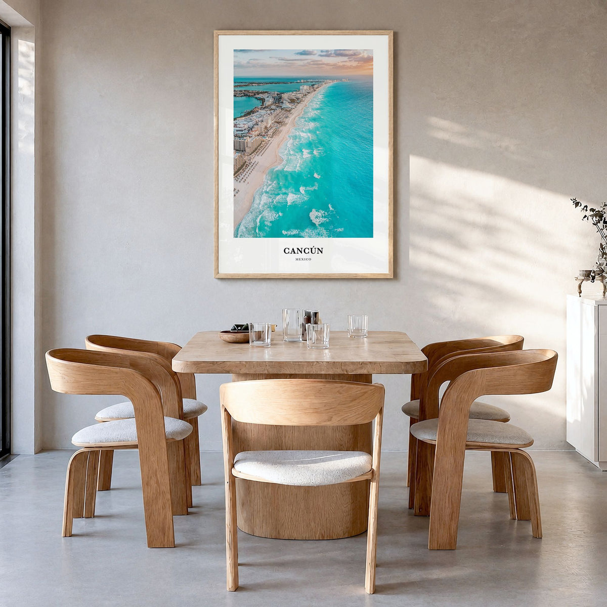 Cancún Classic Poster in a natural wood frame, hanging in a dining room