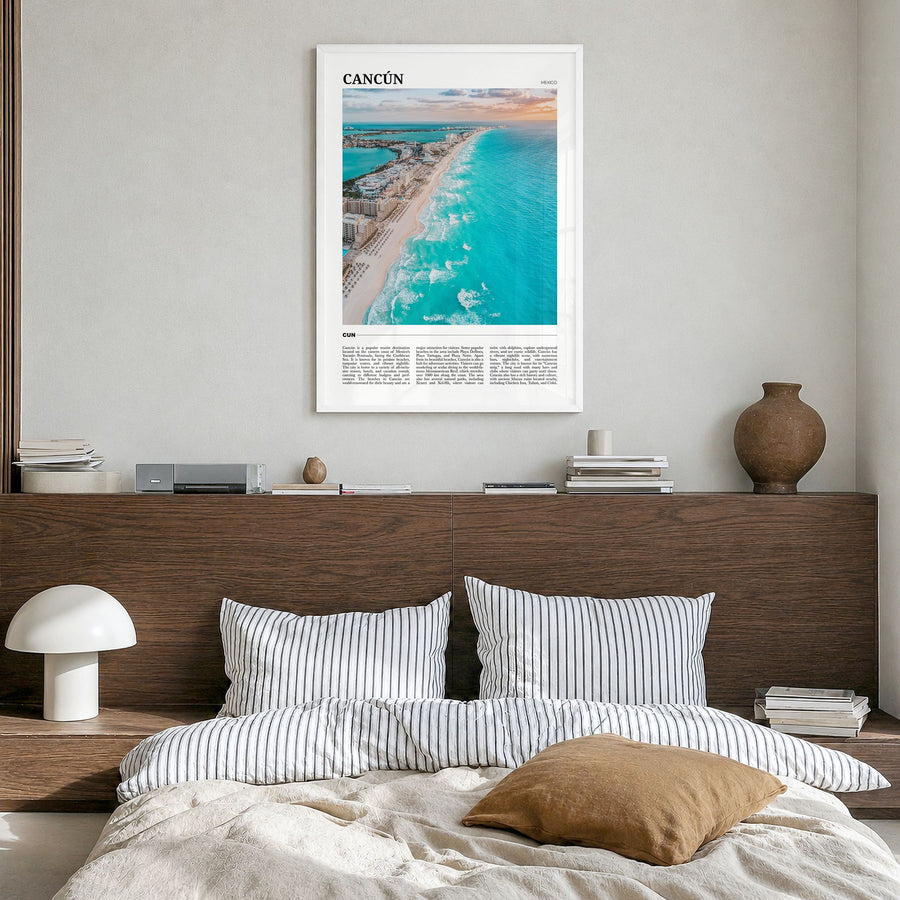 Cancún Travel Poster in a white wood frame, hanging in a bedroom
