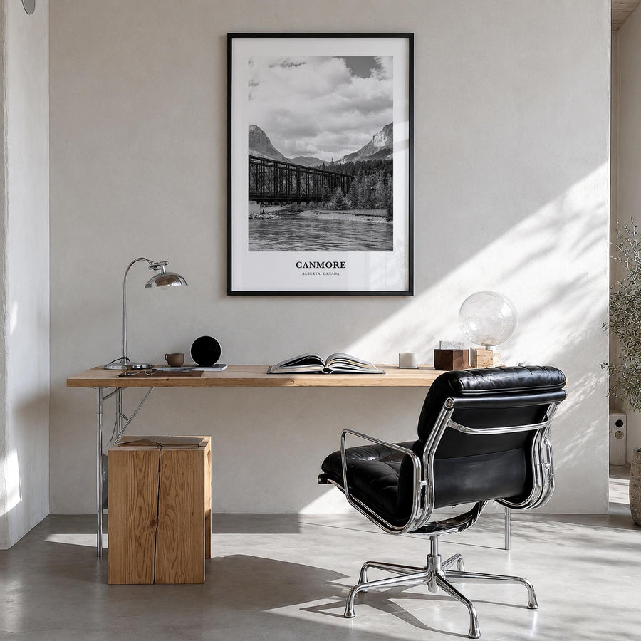 Canmore black & white classic poster of Alberta, Canada – vertical wall art in black wood frame, hanging on wall
