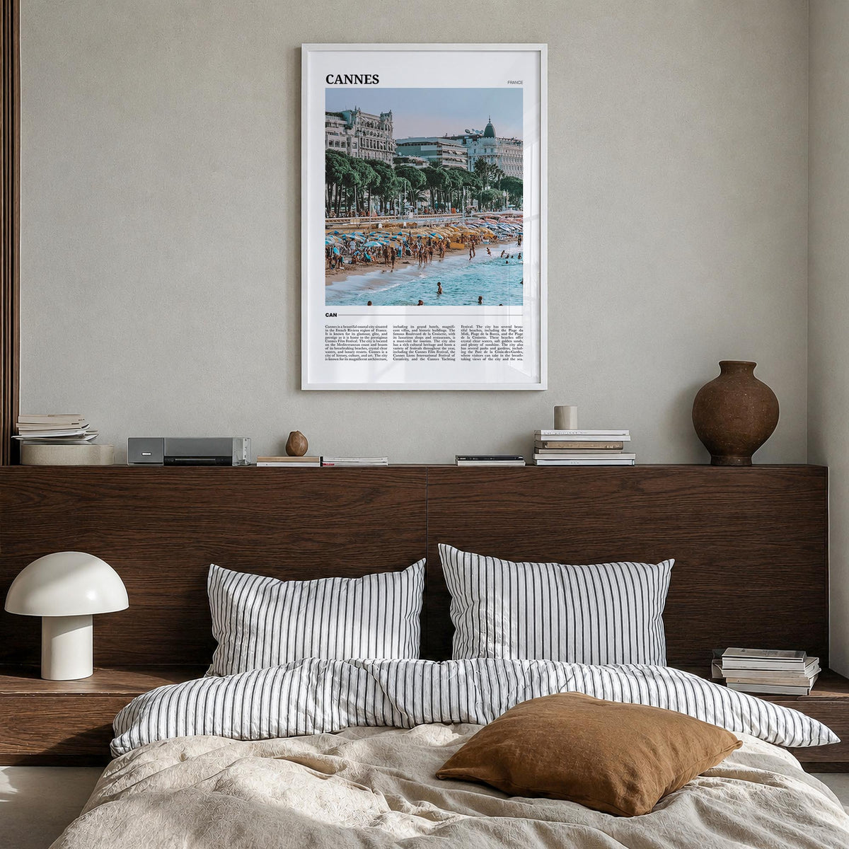 Cannes colorful travel poster of France – vertical wall art in white wood frame, hanging on wall