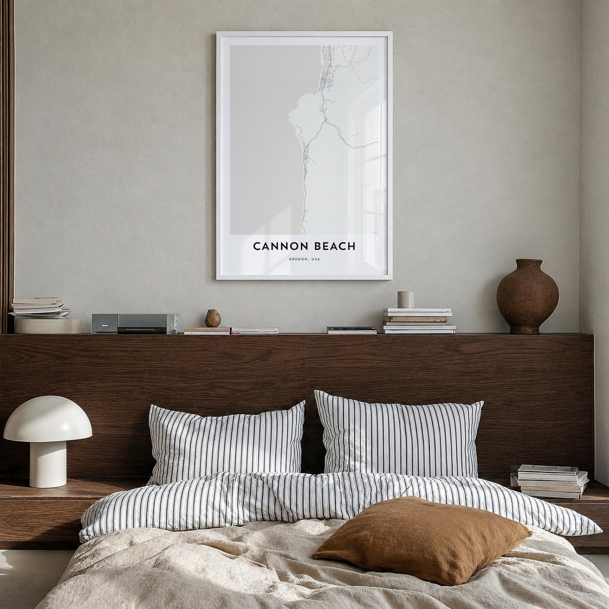 Cannon Beach black & white map poster of Oregon, USA – vertical wall art in white wood frame, hanging on wall