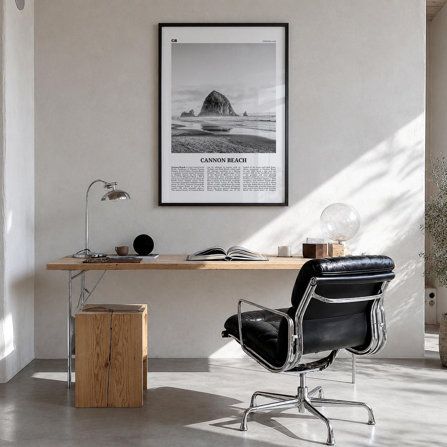 Cannon Beach black & white newspaper poster of Oregon, USA – vertical wall art in black wood frame, hanging on wall