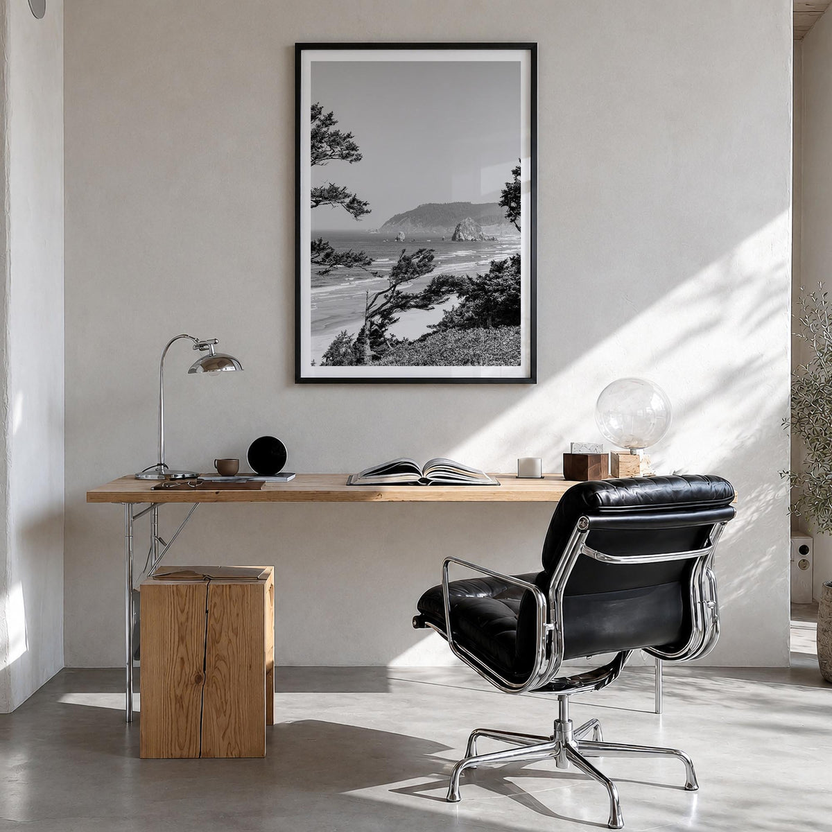 Cannon Beach black & white photo poster of Oregon, USA – vertical wall art in black wood frame with white border, hanging on 