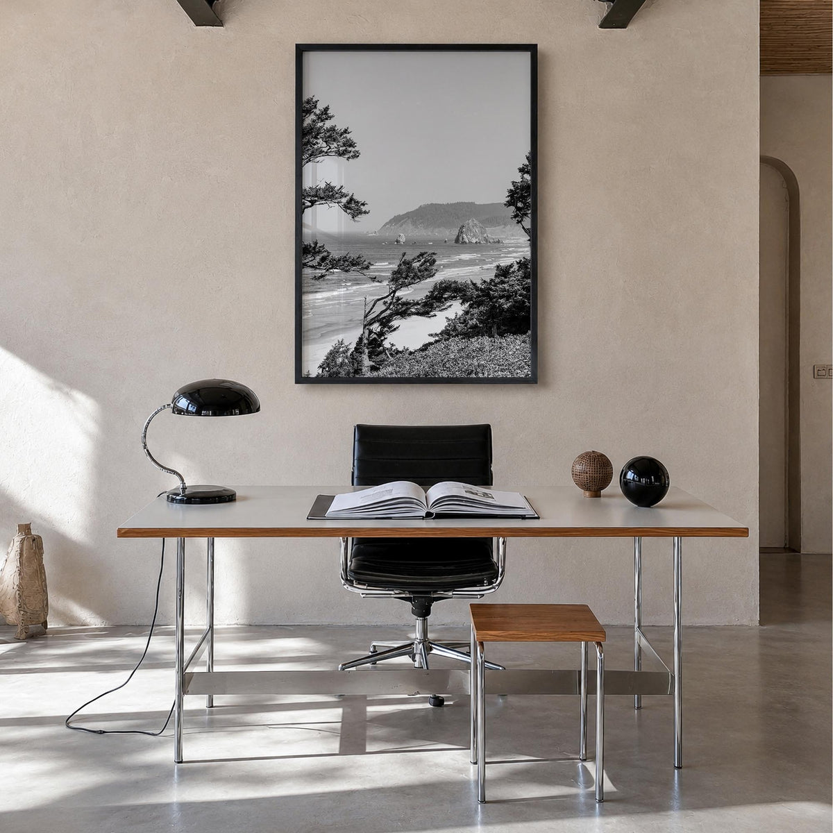 Cannon Beach black & white photo poster of Oregon, USA – vertical wall art in black wood frame, hanging on wall