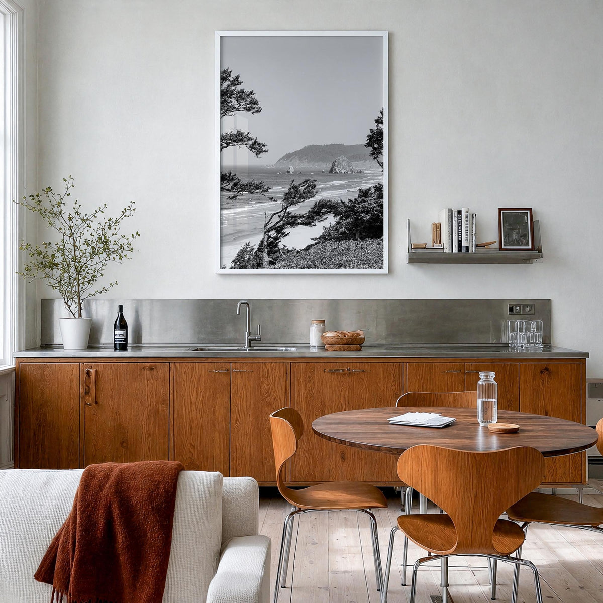 Cannon Beach black & white photo poster of Oregon, USA – vertical wall art in white wood frame, hanging on wall