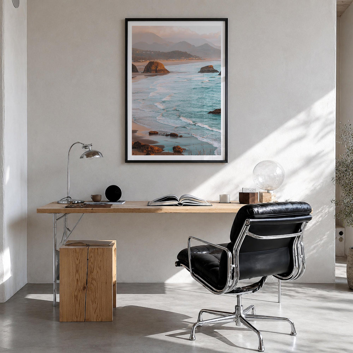 Cannon Beach colorful photo poster of Oregon, USA – vertical wall art in black wood frame with white border, hanging on wall