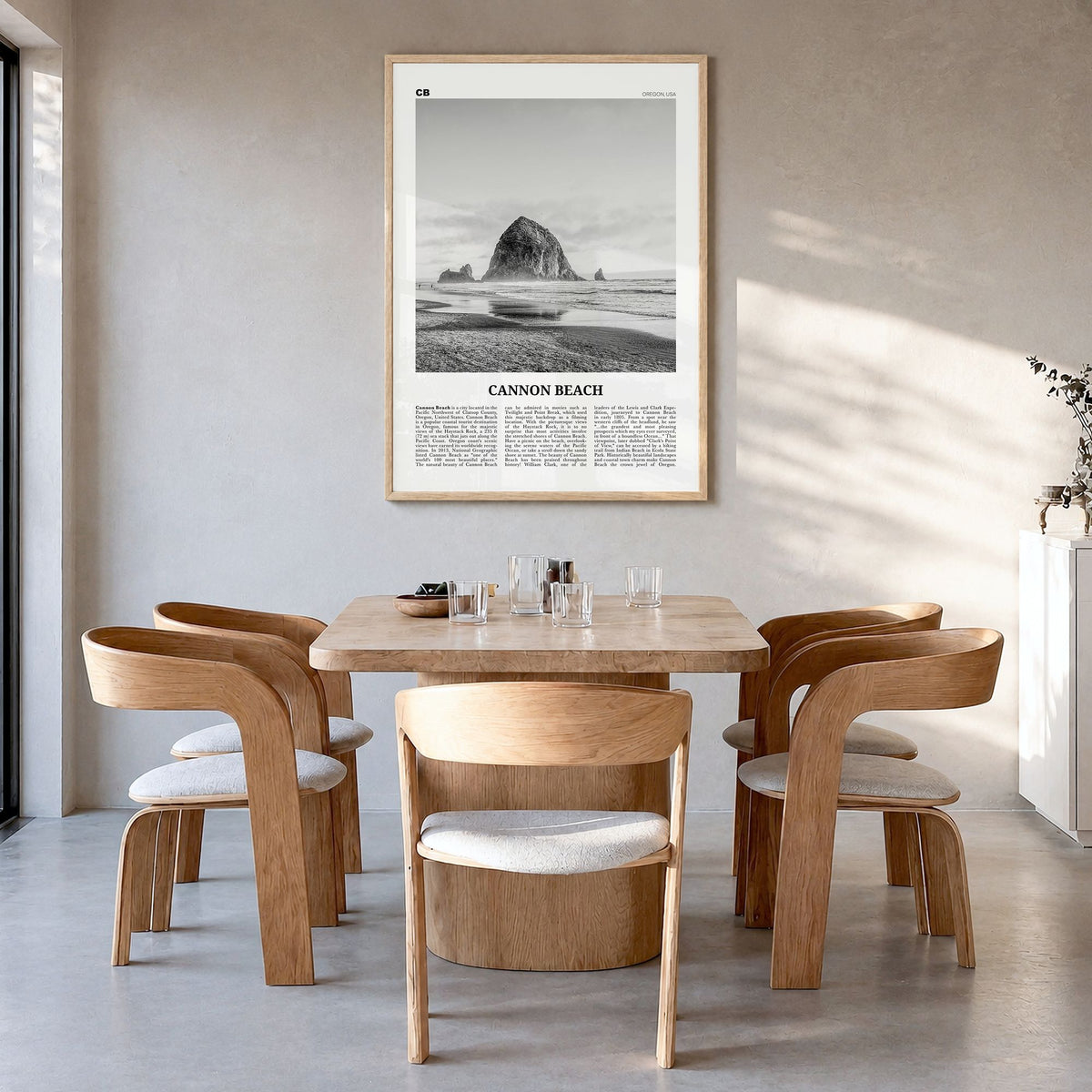 Cannon Beach Newspaper Poster in a natural wood frame, hanging in a dining room