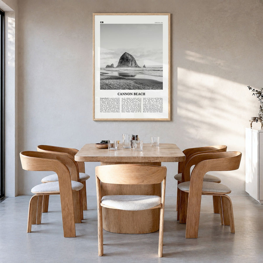 Cannon Beach Newspaper Poster in a natural wood frame, hanging in a dining room