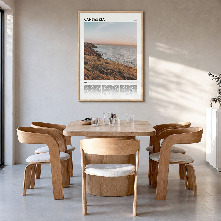 Cantabria Travel Poster in a natural wood frame, hanging in a dining room