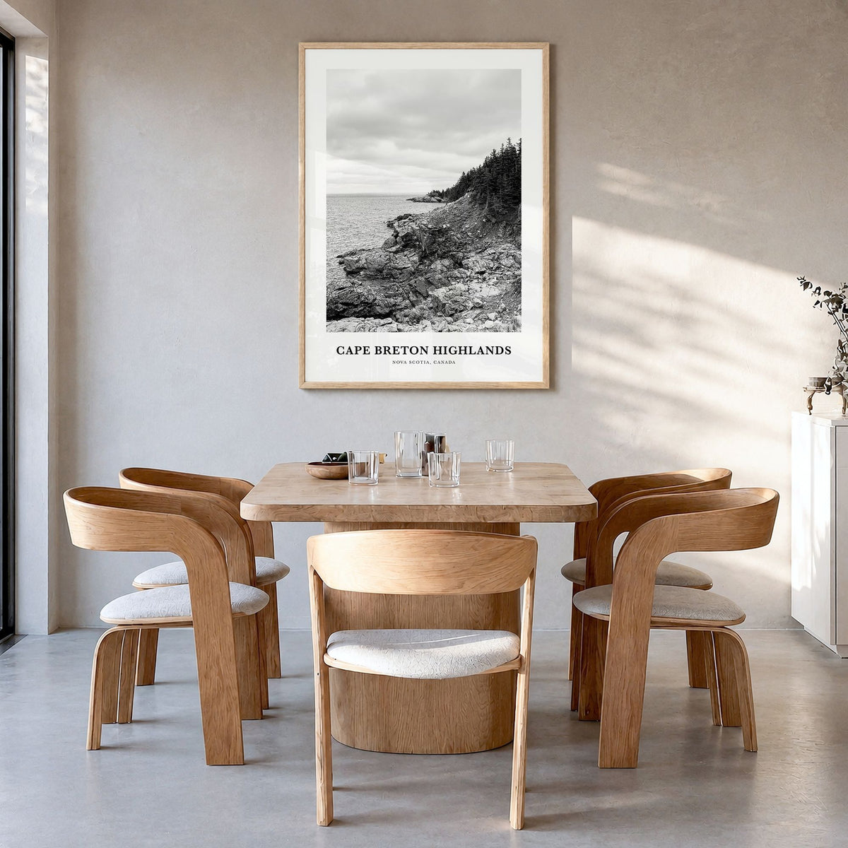 Cape Breton Highlands National Park Classic Poster in a natural wood frame, hanging in a dining room