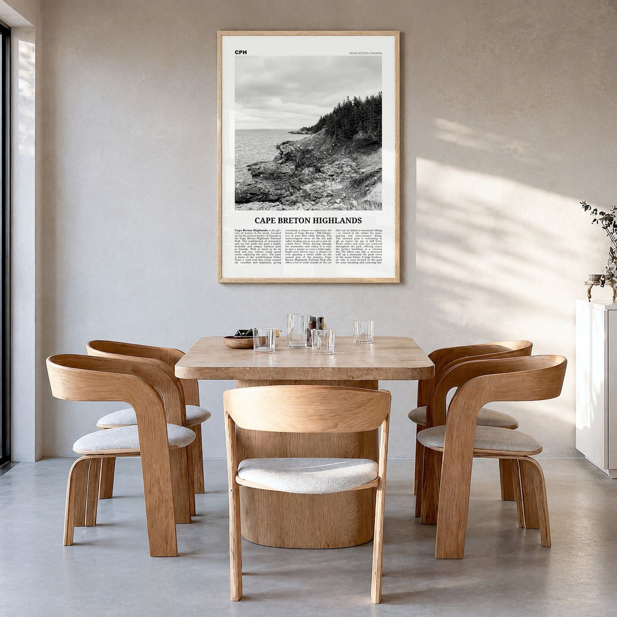 Cape Breton Highlands National Park Newspaper Poster in a natural wood frame, hanging in a dining room