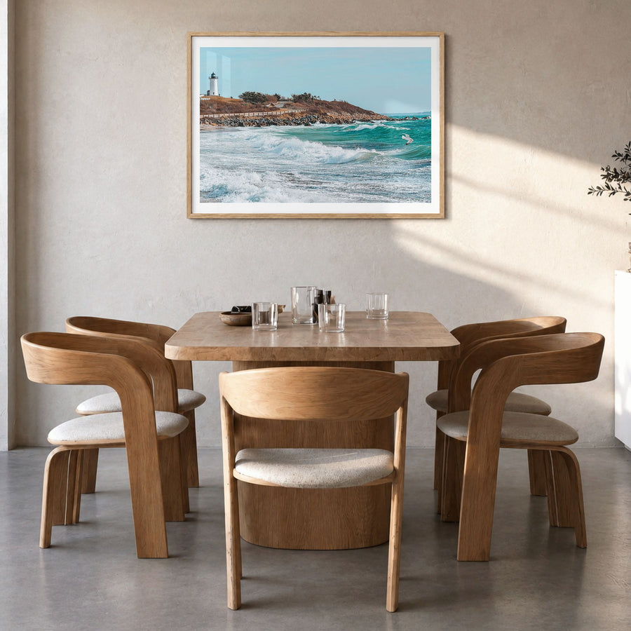 Cape Cod Photo Poster in a natural wood frame, hanging in a dining room, white border