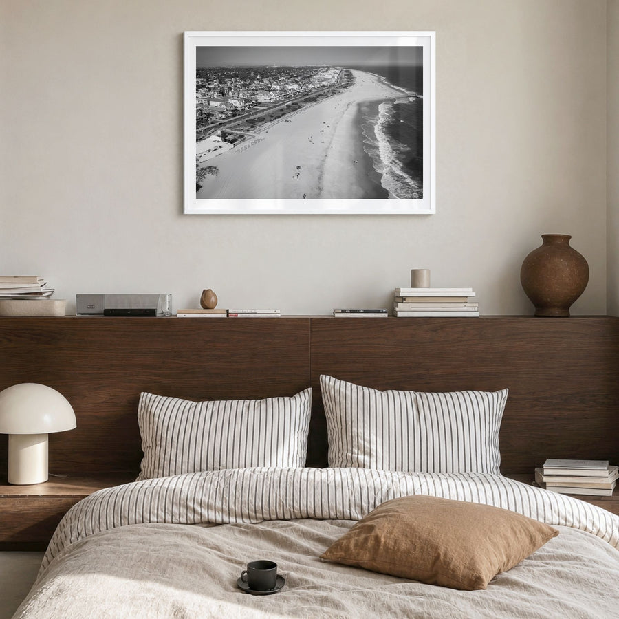Cape May Photo Poster in a white wood frame, hanging in a bedroom, white border