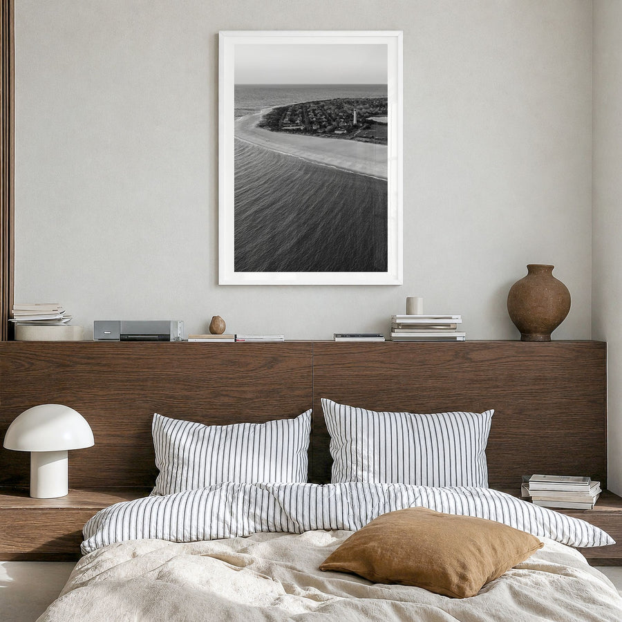 Cape May Photo Poster in a white wood frame, hanging in a bedroom, white border