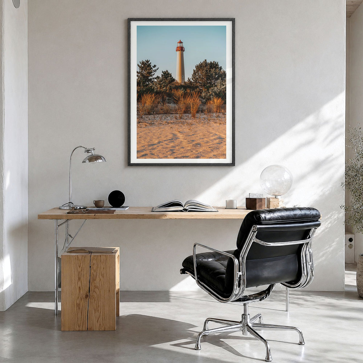 Cape May Photo Poster in a black wood frame, hanging in a bright home office, white border