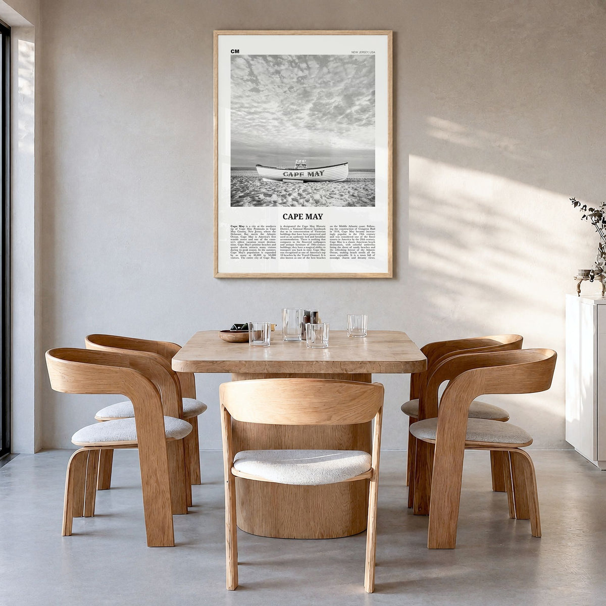 Cape May Newspaper Poster in a natural wood frame, hanging in a dining room