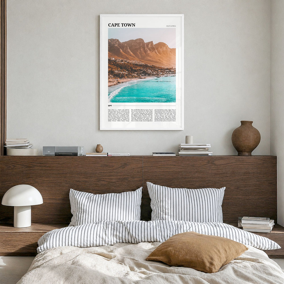 Cape Town Travel Poster in a white wood frame, hanging in a bedroom