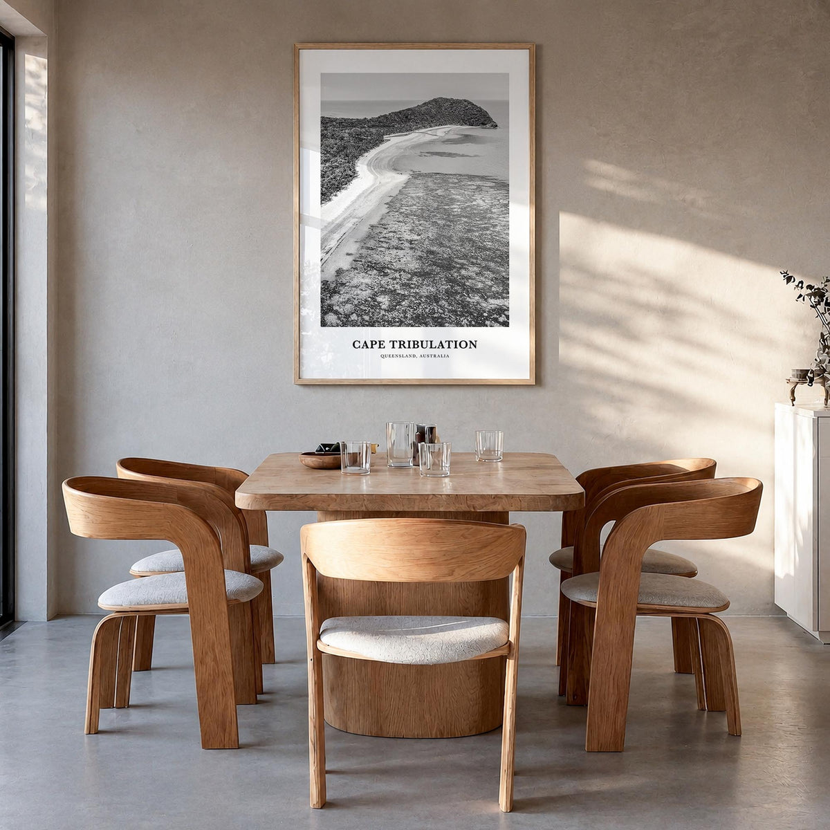Cape Tribulation black & white classic poster of Australia – vertical wall art in natural wood frame, hanging on wall