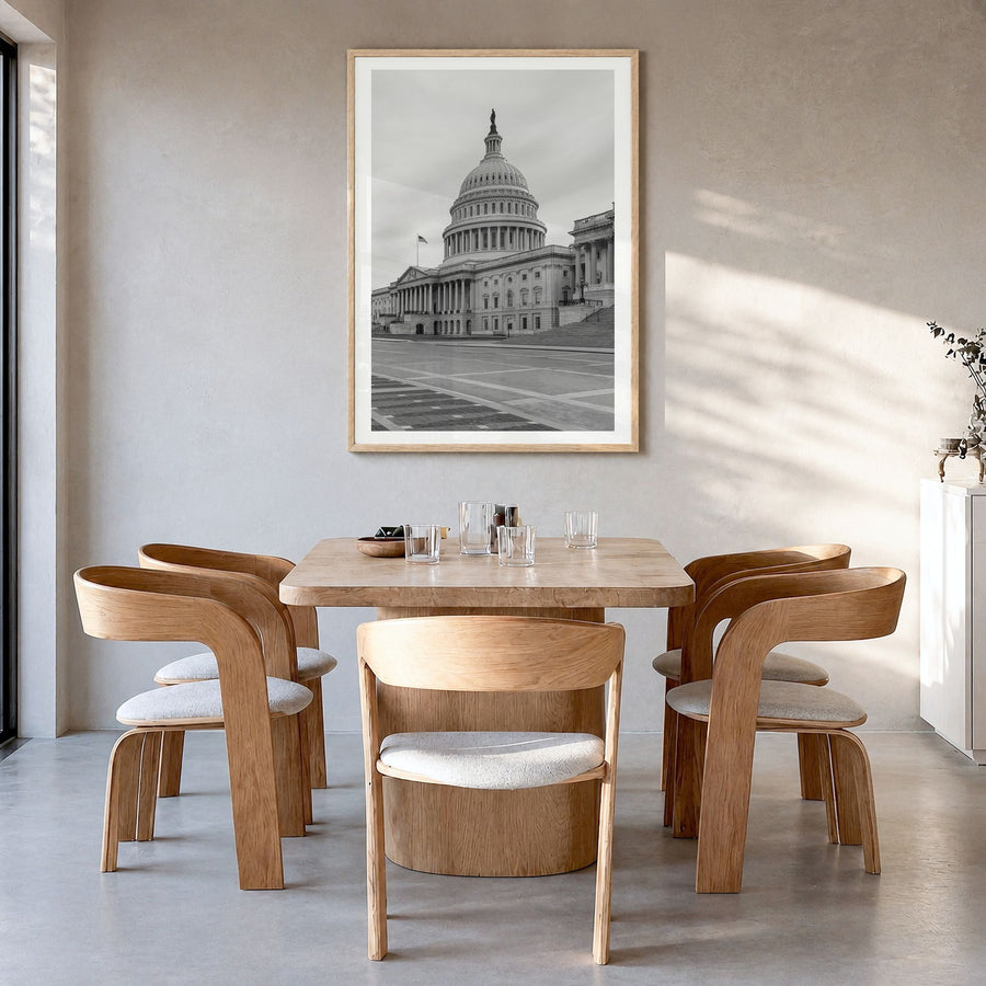 Capitol Hill Photo Poster in a natural wood frame, hanging in a dining room, white border