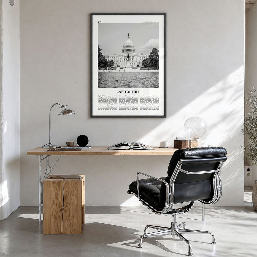 Capitol Hill Newspaper Poster in a black wood frame, hanging in a bright home office