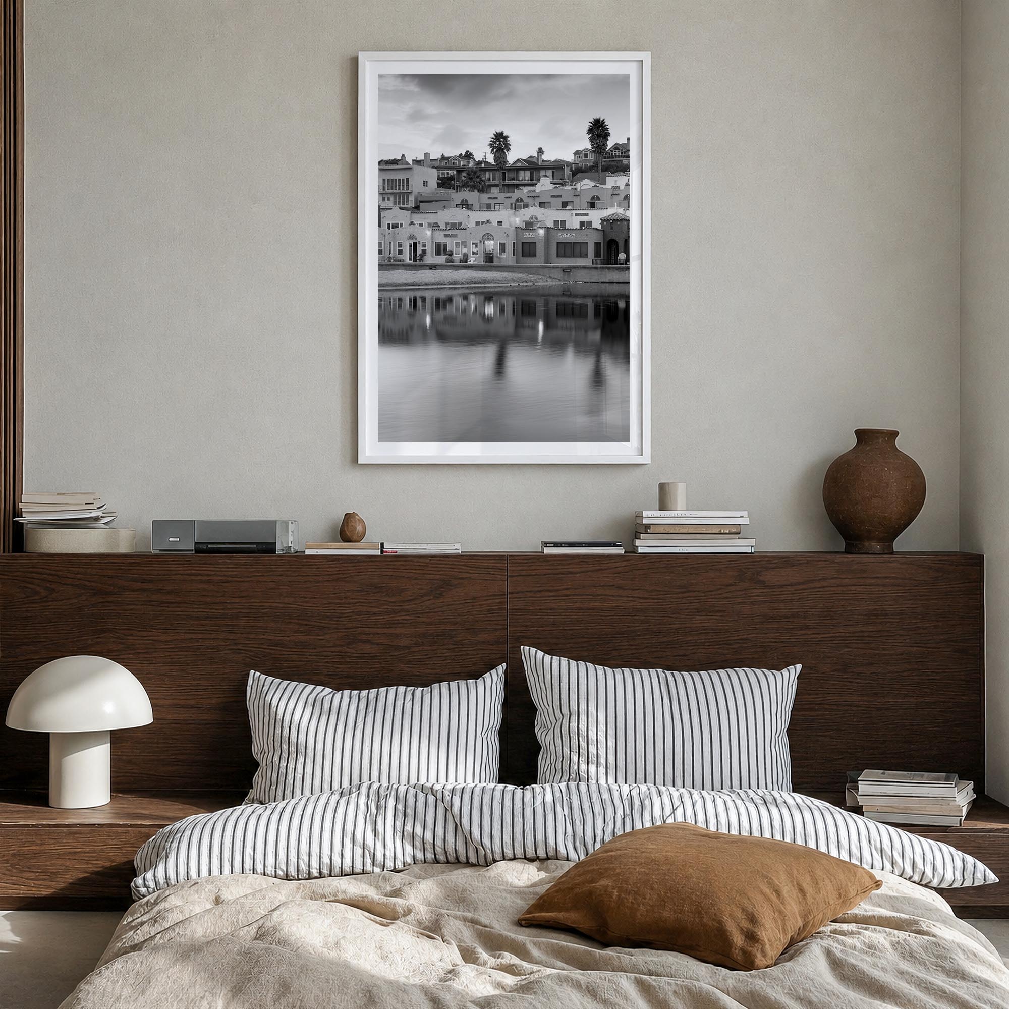 Capitola black & white photo poster of California, USA – vertical wall art in white wood frame with white border, hanging on 