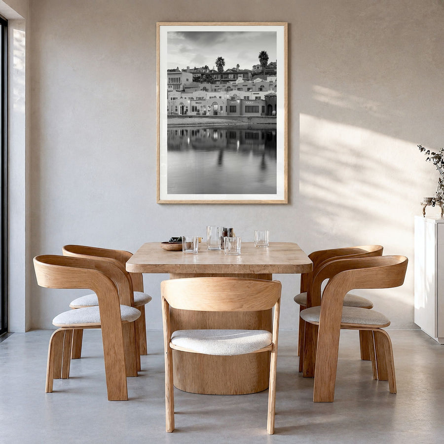 Capitola Photo Poster in a natural wood frame, hanging in a dining room, white border
