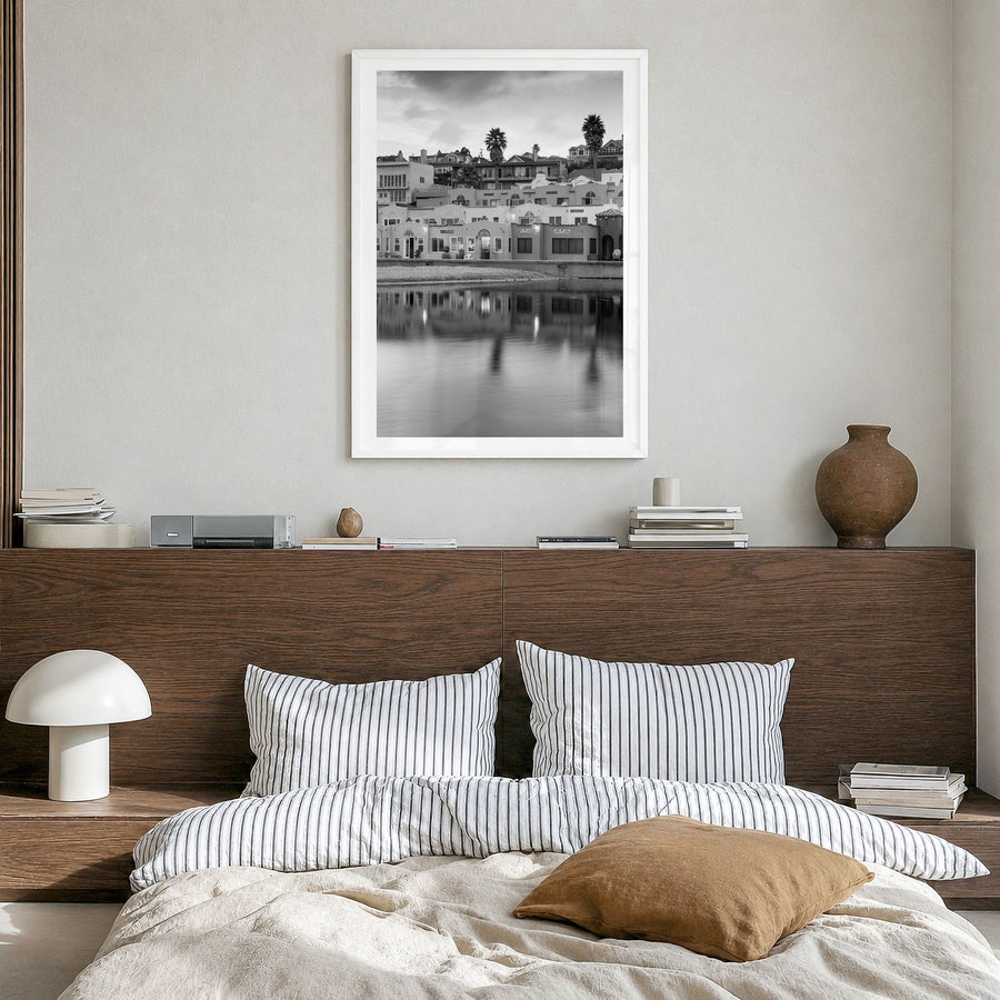 Capitola Photo Poster in a white wood frame, hanging in a bedroom, white border
