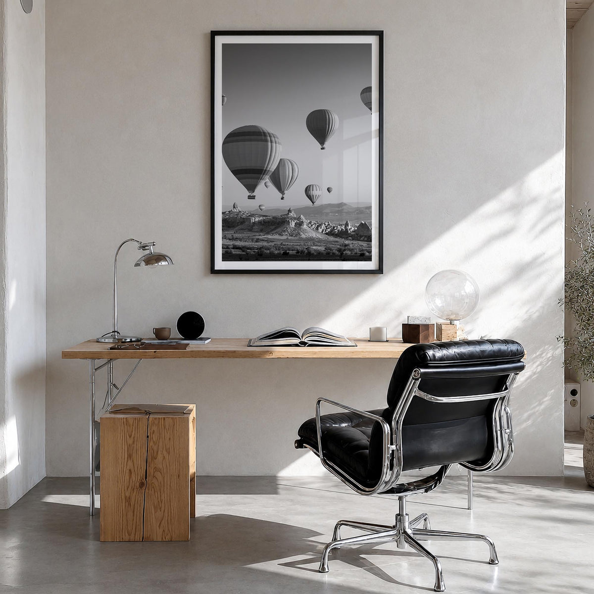 Cappadocia black & white photo poster of Türkiye – vertical wall art in black wood frame with white border, hanging on wall