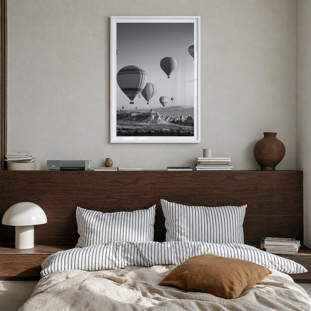 Cappadocia black & white photo poster of Türkiye – vertical wall art in white wood frame with white border, hanging on wall