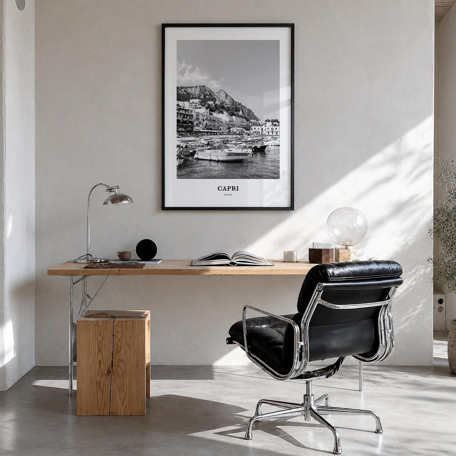 Capri black & white classic poster of Italy – vertical wall art in black wood frame, hanging on wall