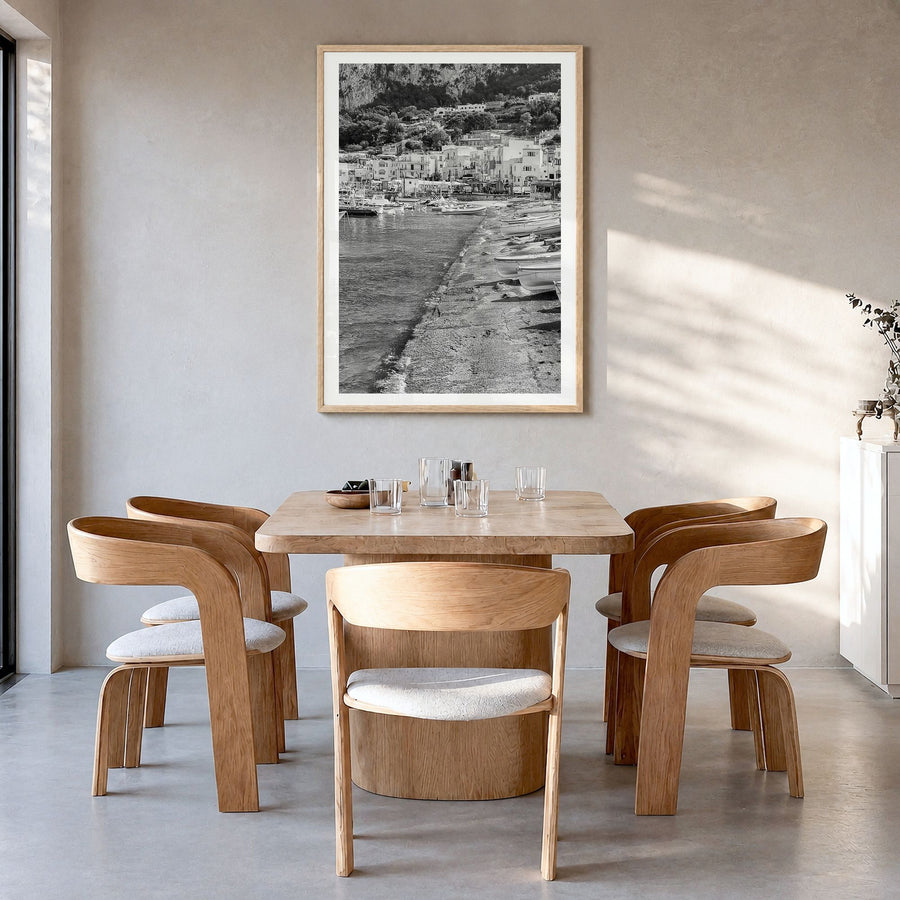 Capri Photo Poster in a natural wood frame, hanging in a dining room, white border