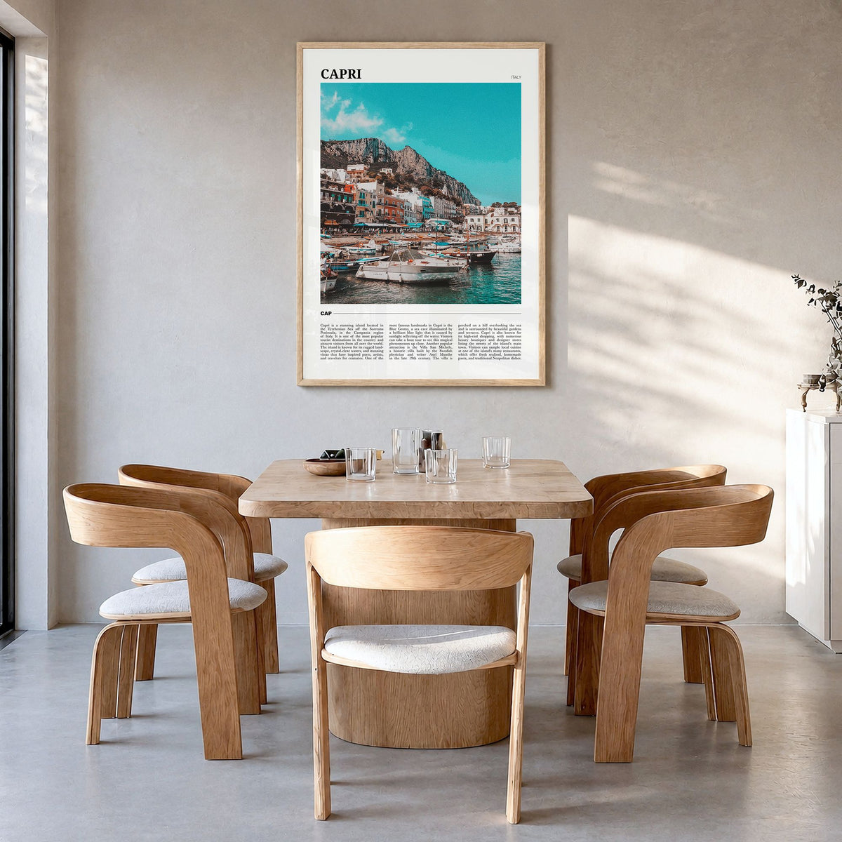 Capri Travel Poster in a natural wood frame, hanging in a dining room
