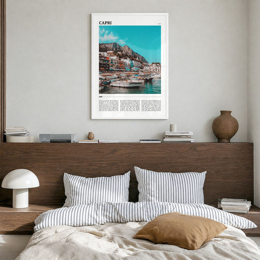 Capri Travel Poster in a white wood frame, hanging in a bedroom