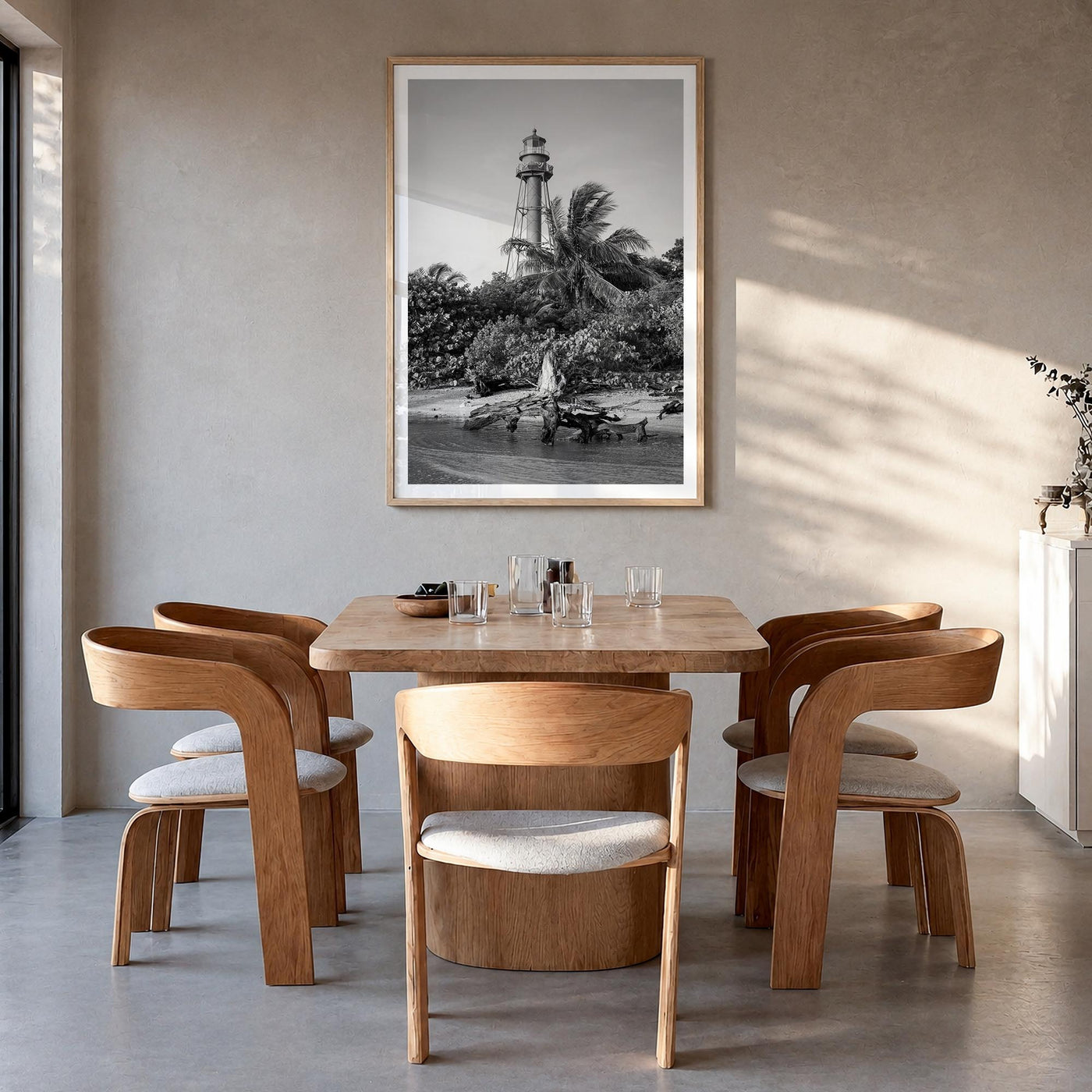 Captiva black & white photo poster of Florida, USA – vertical wall art in natural wood frame with white border, hanging on wa