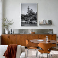 Captiva black & white photo poster of Florida, USA – vertical wall art in white wood frame, hanging on wall