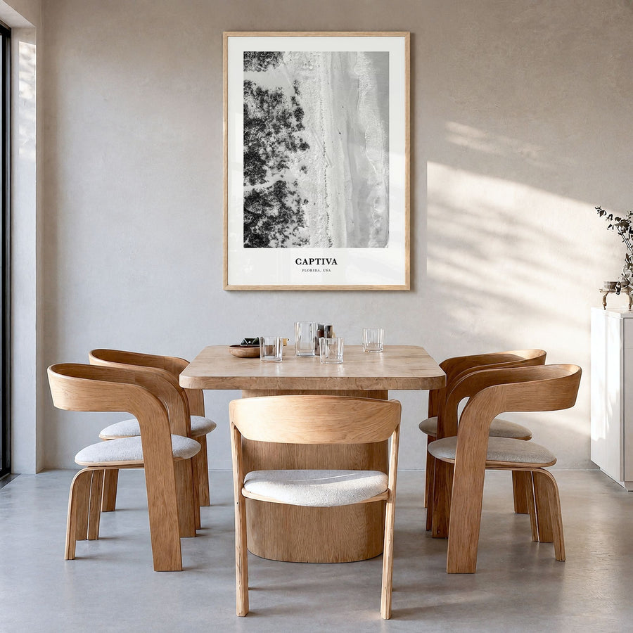 Captiva Classic No 1 Poster in a natural wood frame, hanging in a dining room