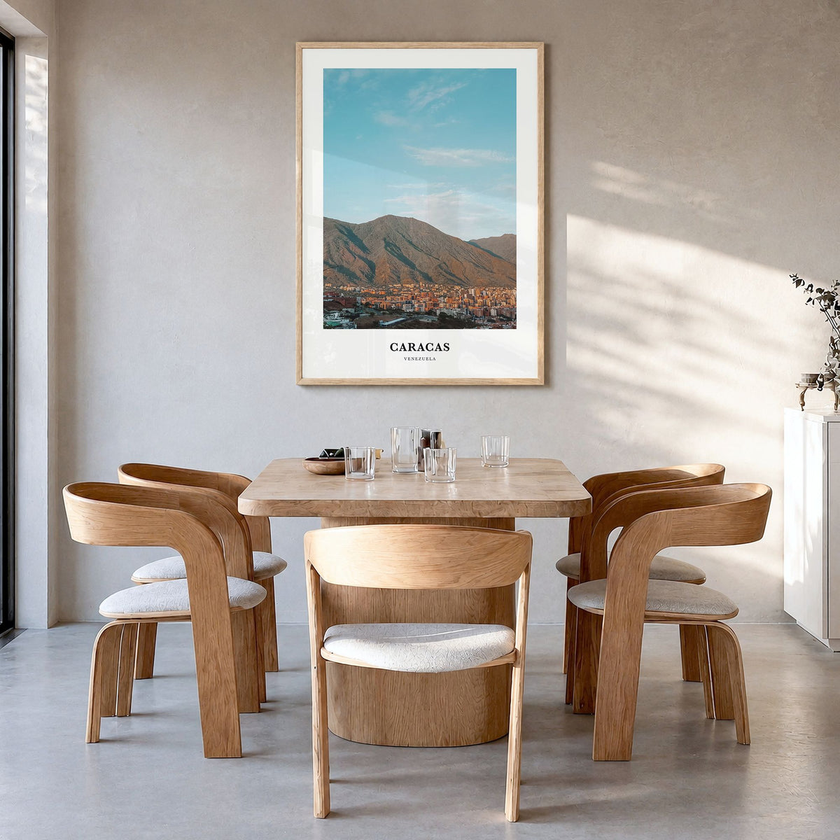 Caracas Classic No 1 Poster in a natural wood frame, hanging in a dining room