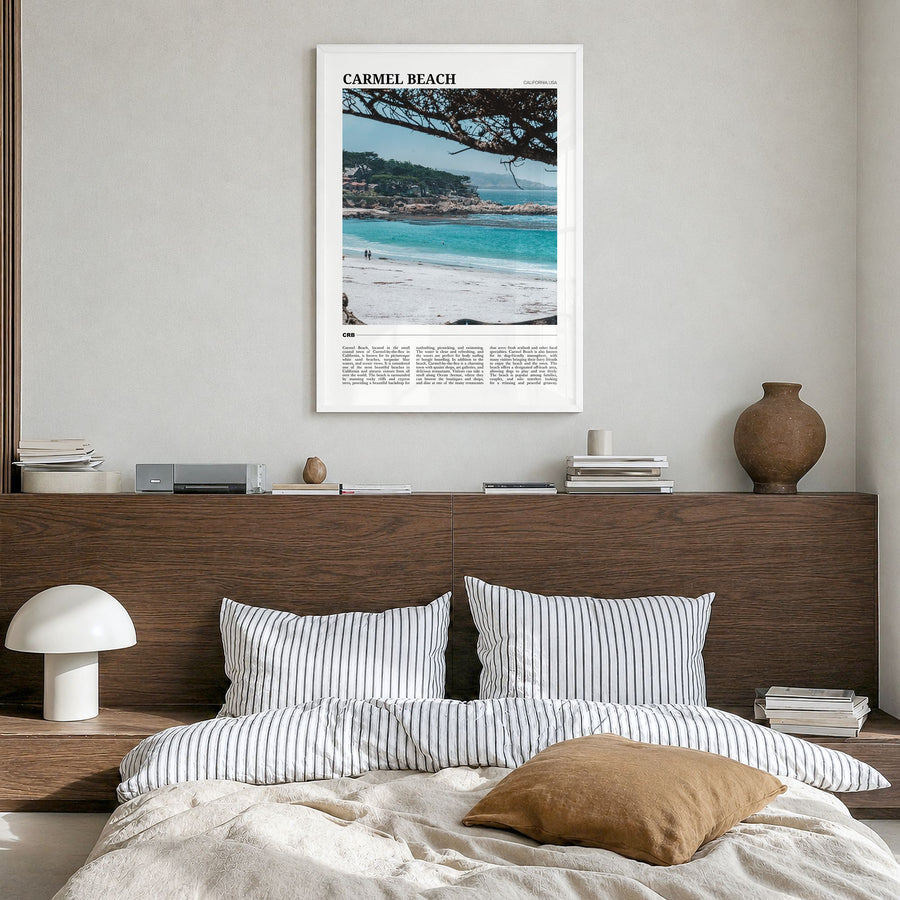 Carmel Beach Travel Poster in a white wood frame, hanging in a bedroom