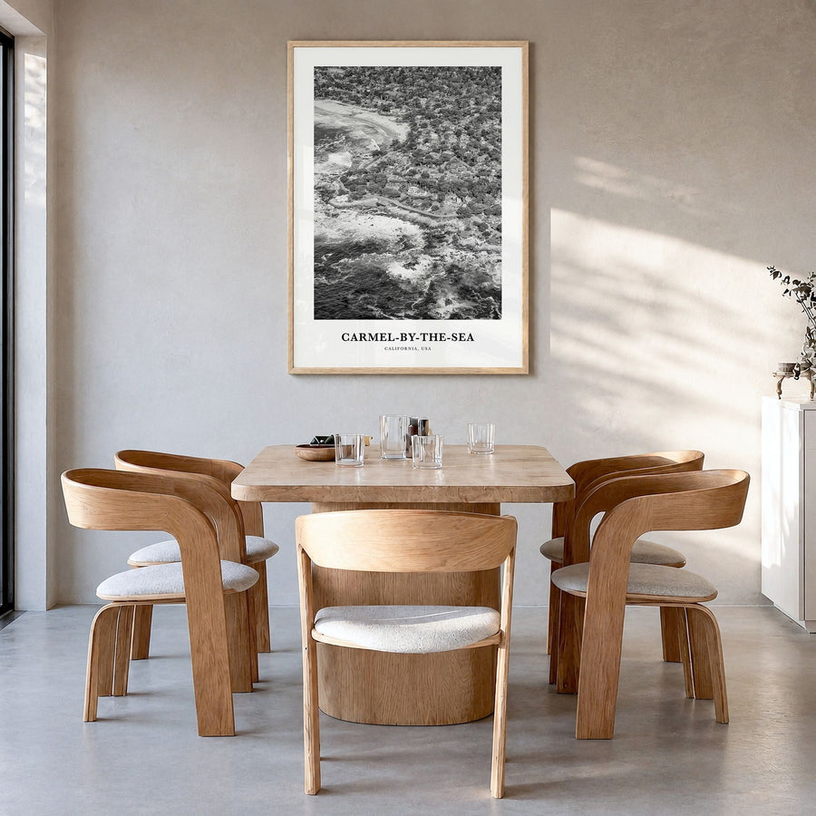 Carmel-by-the-Sea Classic Poster in a natural wood frame, hanging in a dining room