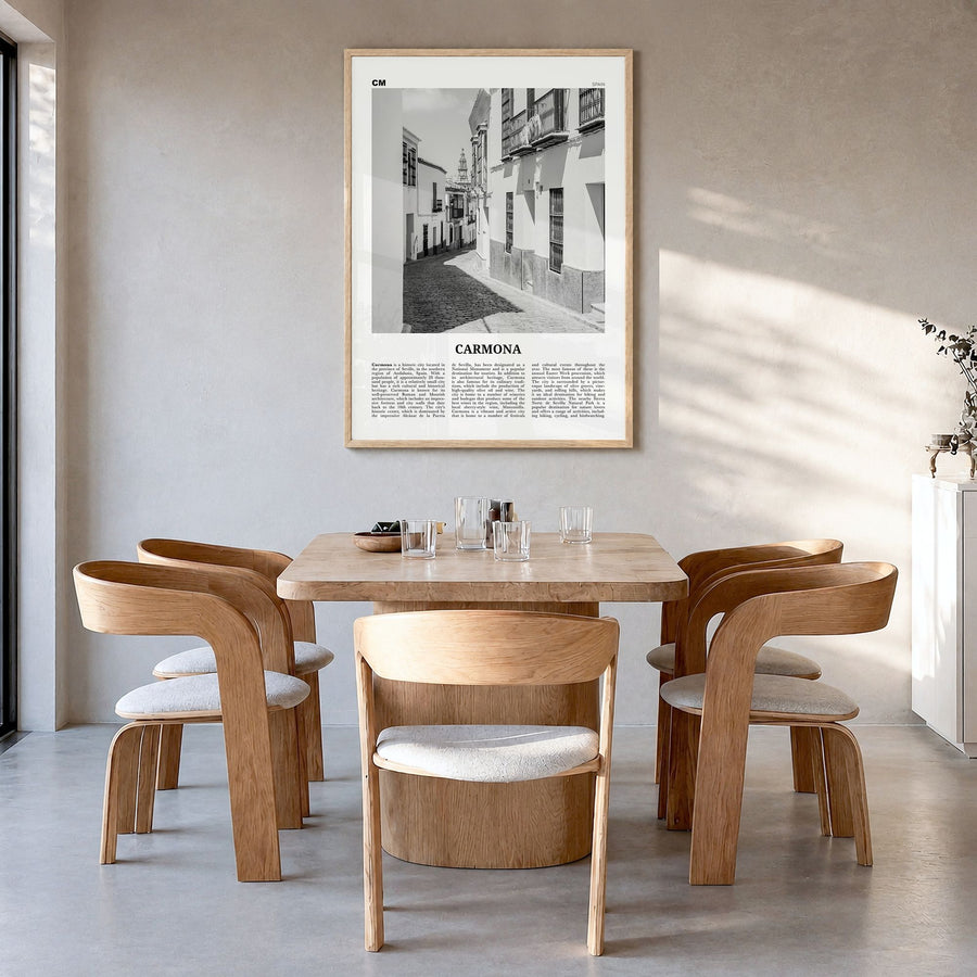 Carmona Newspaper Poster in a natural wood frame, hanging in a dining room