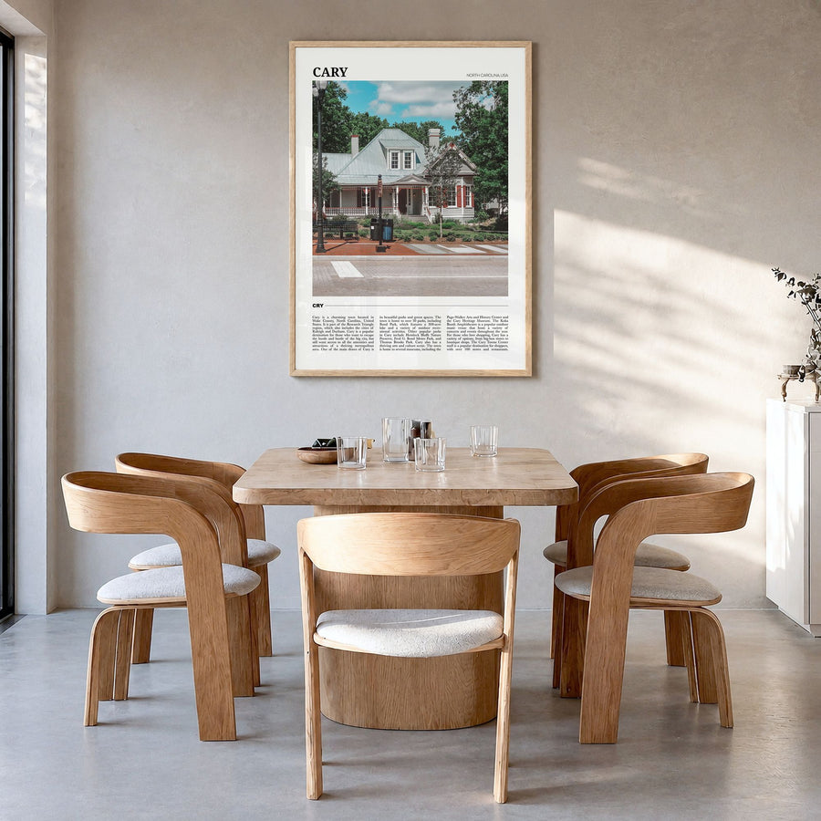 Cary Travel Poster in a natural wood frame, hanging in a dining room