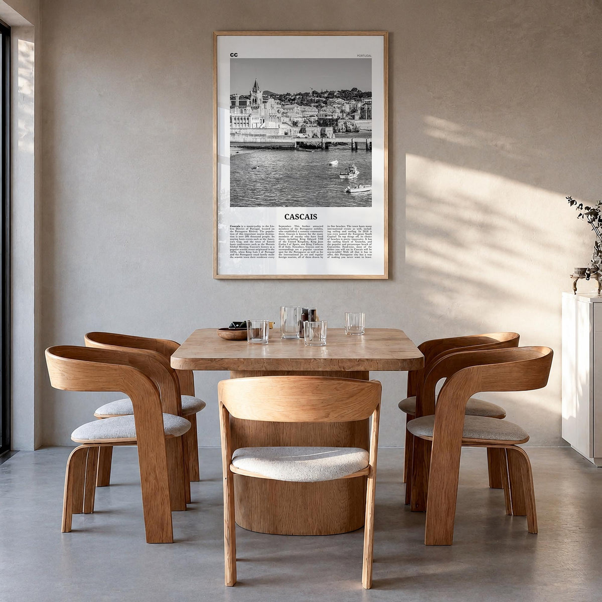 Cascais black & white newspaper poster of Portugal – vertical wall art in natural wood frame, hanging on wall